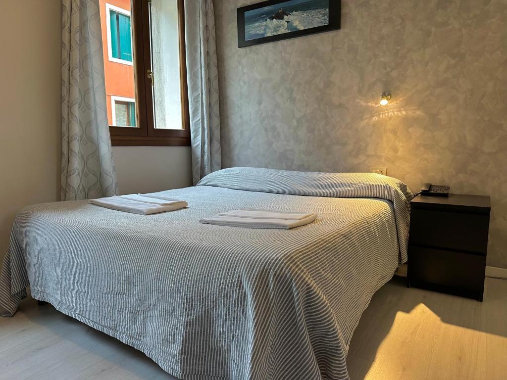 Postel nebo postele na pokoji v ubytování Albergo Roma