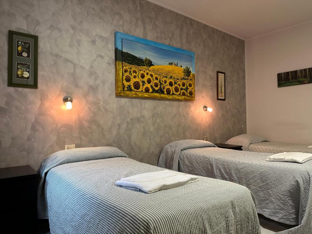 Postel nebo postele na pokoji v ubytování Albergo Roma