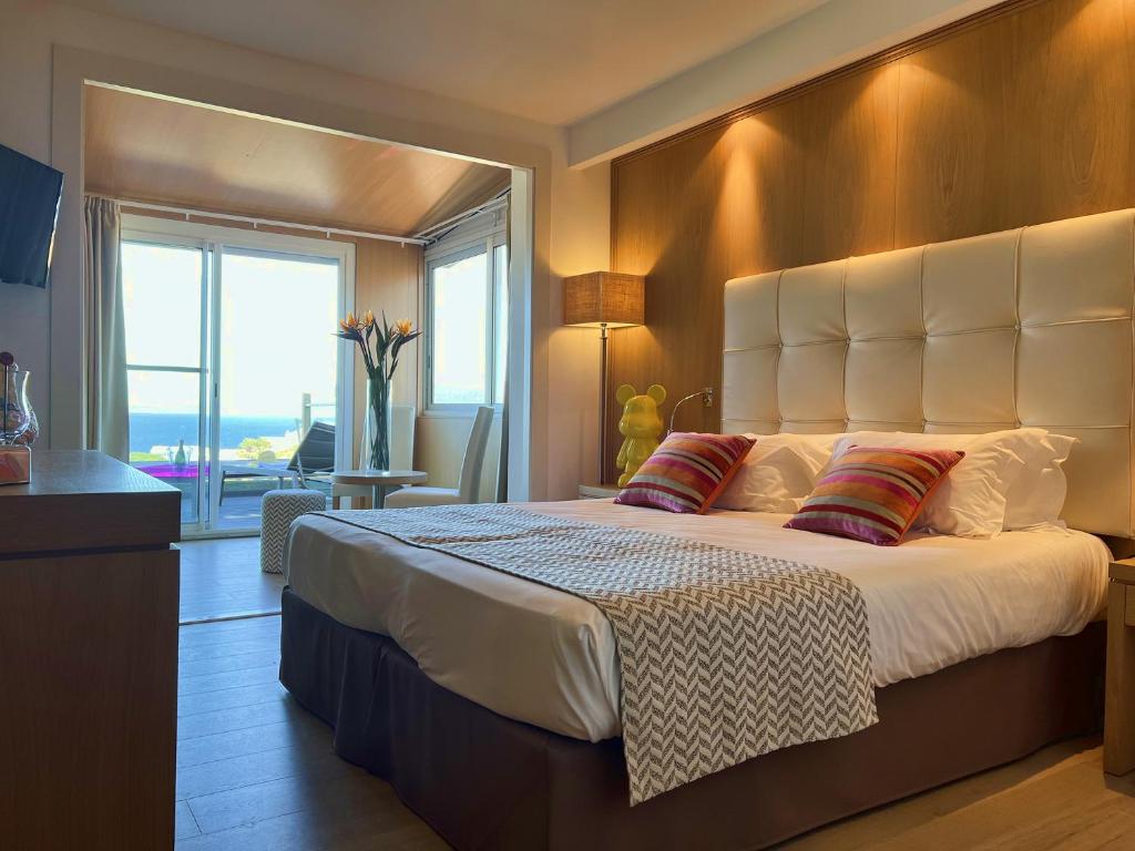 Postel nebo postele na pokoji v ubytování Hotel Revellata & Spa