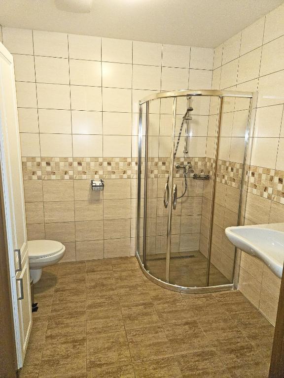 Koupelna v ubytování Apartmány Řezáč