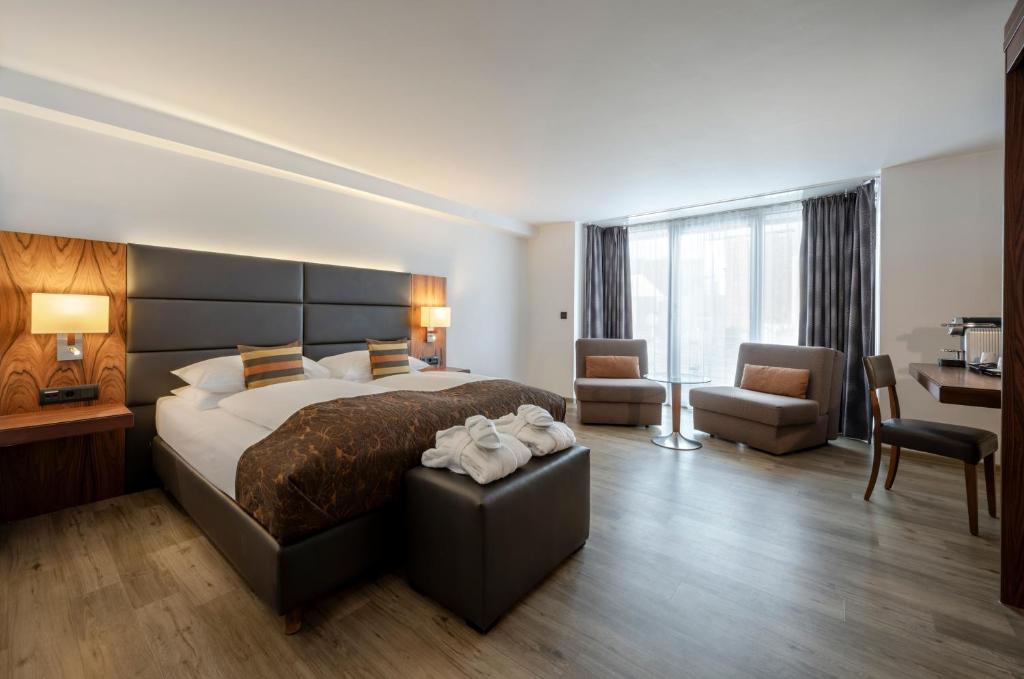 Postel nebo postele na pokoji v ubytování Hotel IMLAUER Wien
