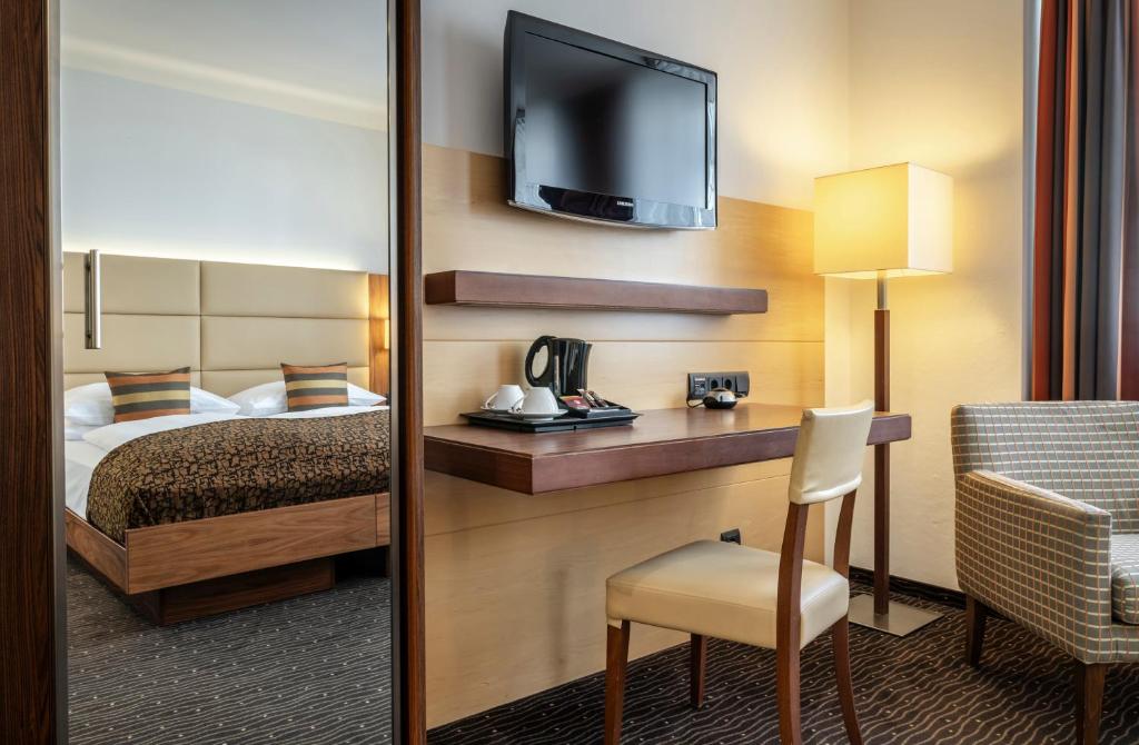 Postel nebo postele na pokoji v ubytování Hotel IMLAUER Wien