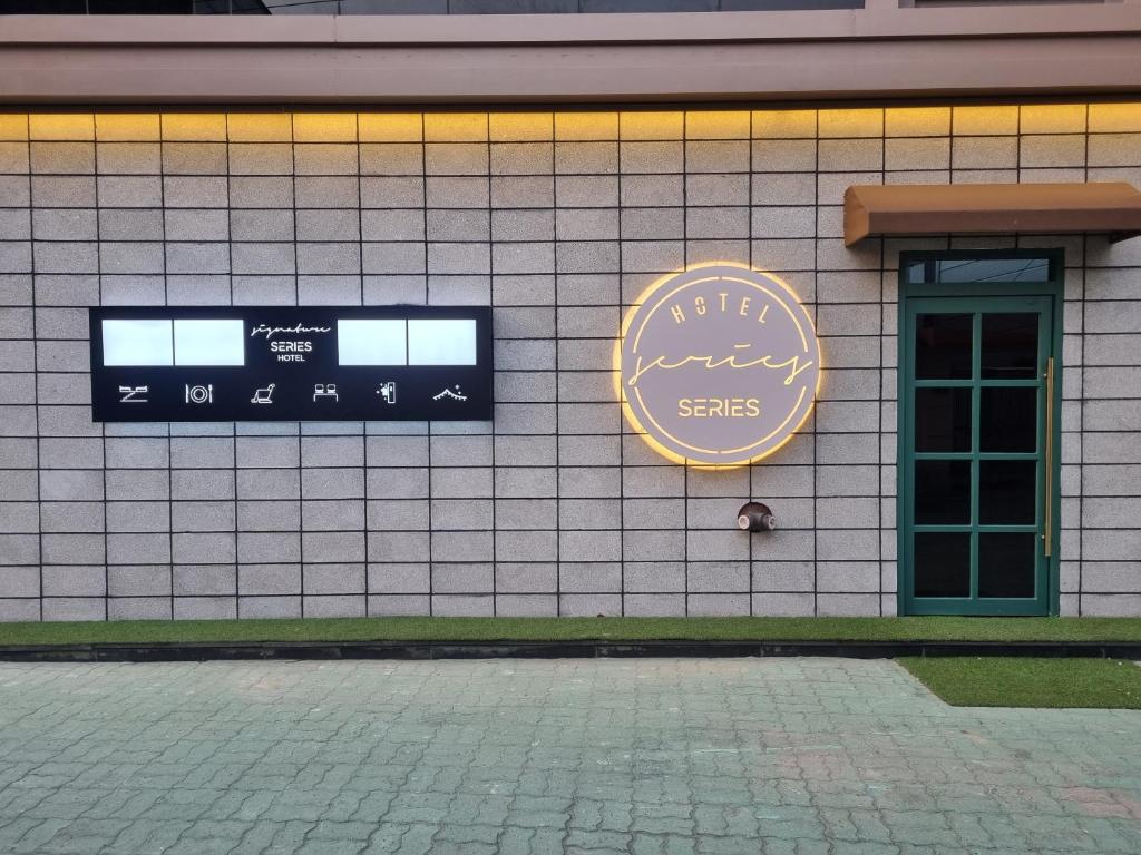 a building with a sign on the side of it at Series hotel in Gyeongju