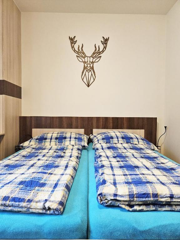 Postel nebo postele na pokoji v ubytování Apartmány Řezáč