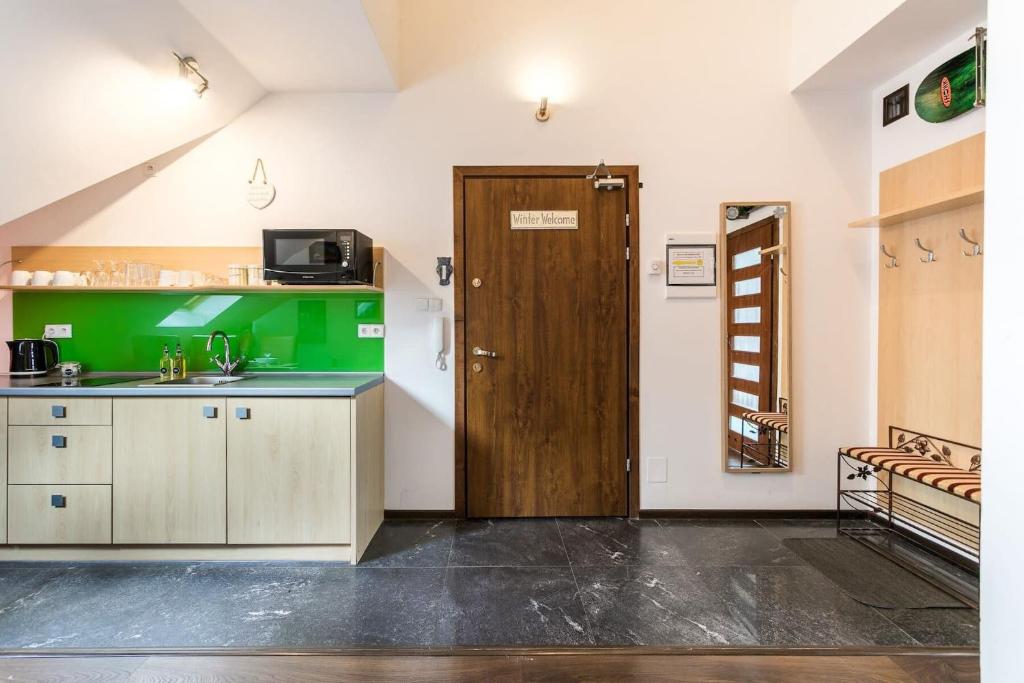 Kuchyňa alebo kuchynka v ubytovaní Rent like home - Strzelców 30C
