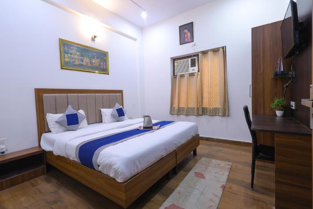 Postel nebo postele na pokoji v ubytování Taj Classic Agra