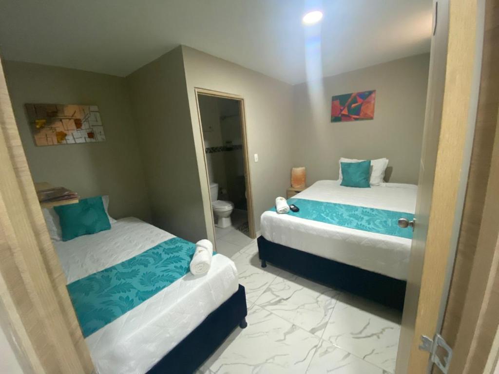 Postel nebo postele na pokoji v ubytování HOTEL LUXEM