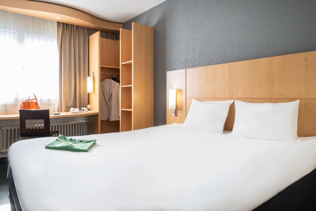 Postel nebo postele na pokoji v ubytování ibis Genève Centre Gare