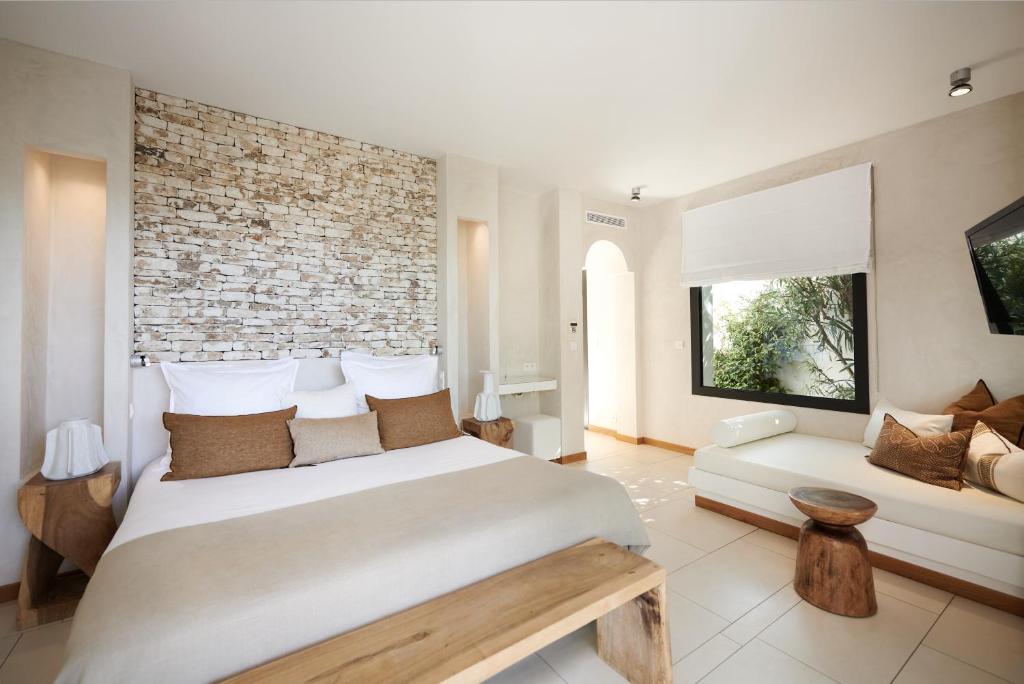 Postel nebo postele na pokoji v ubytování Hôtel Cala di Greco