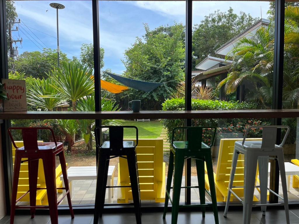 a window view of a table and chairs at Hanoii House in Ko Mak