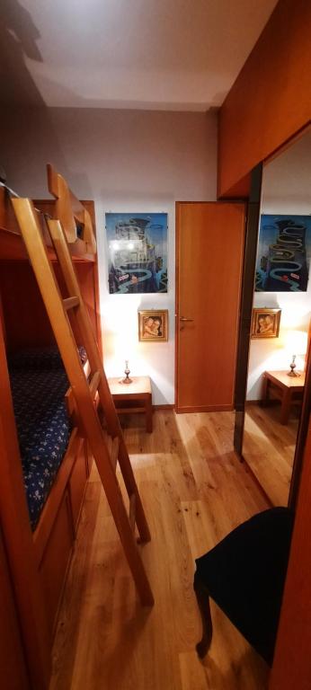 Posteľ alebo postele v izbe v ubytovaní Appartamento di Montagna - Residence 'La Ginestra'