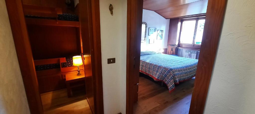 Posteľ alebo postele v izbe v ubytovaní Appartamento di Montagna - Residence 'La Ginestra'