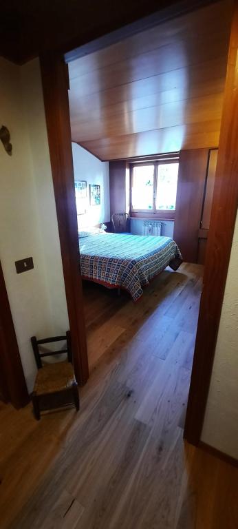 Posteľ alebo postele v izbe v ubytovaní Appartamento di Montagna - Residence 'La Ginestra'