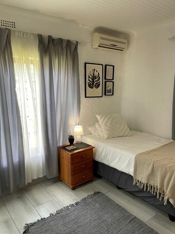 Una cama o camas en una habitación de Groenewald's Haven