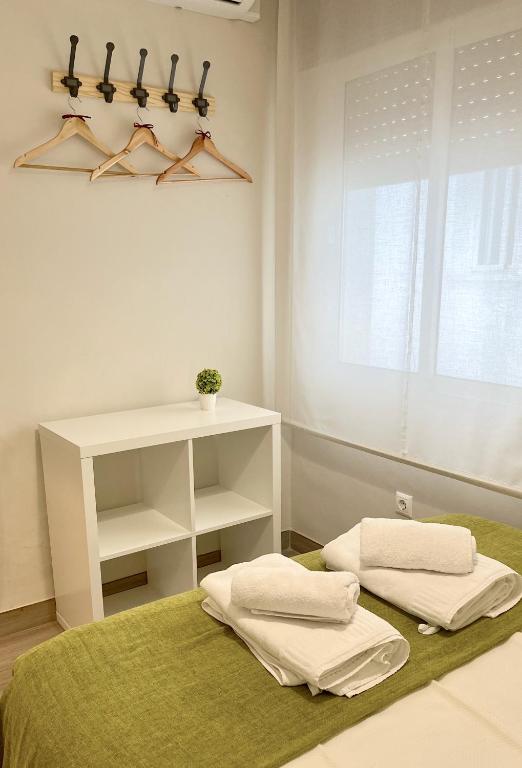 A bed or beds in a room at La Casa de la Muralla