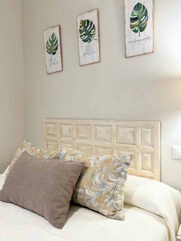 A bed or beds in a room at La Casa de la Muralla