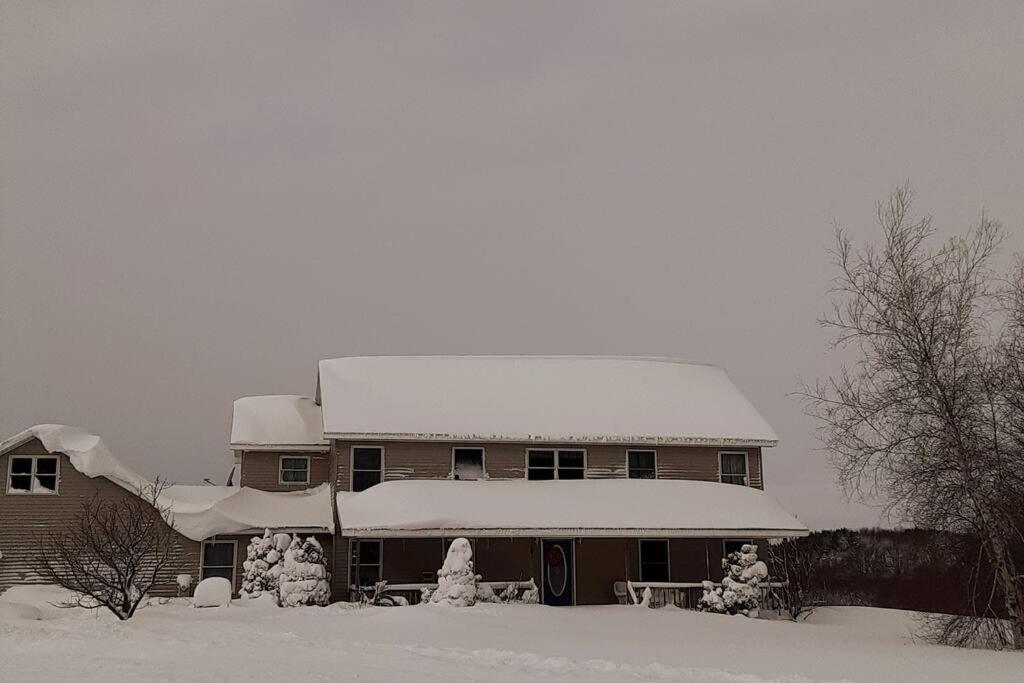 a house with snow on the top of it at Tug Hill Paradise, Copenhagen, NY 