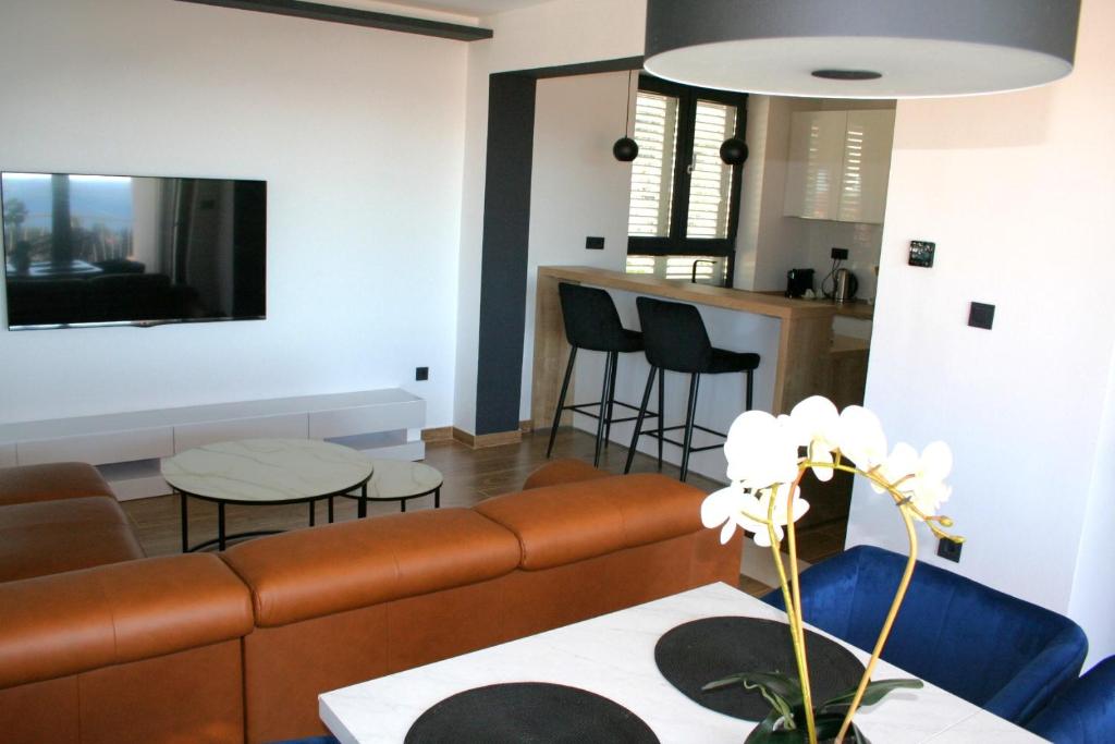 a living room with a couch and a table at Apartment Terezija in Dubrovnik
