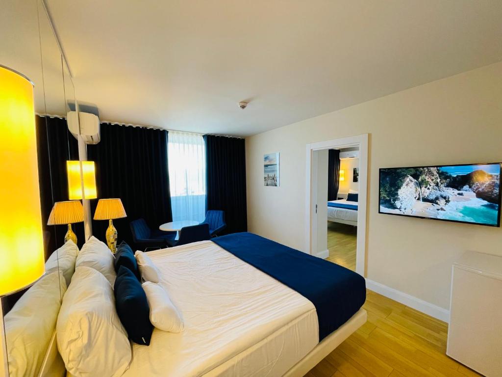 Postel nebo postele na pokoji v ubytování Batumi VIP hotel