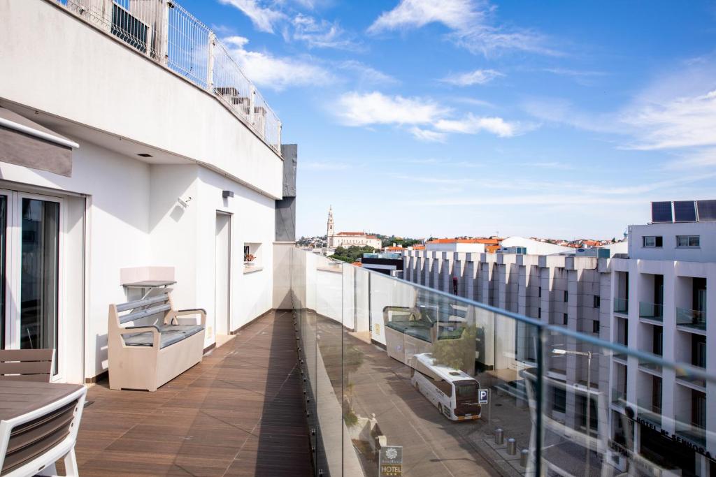 an apartment balcony with a view of a city at Macrisbete 4 in Fátima