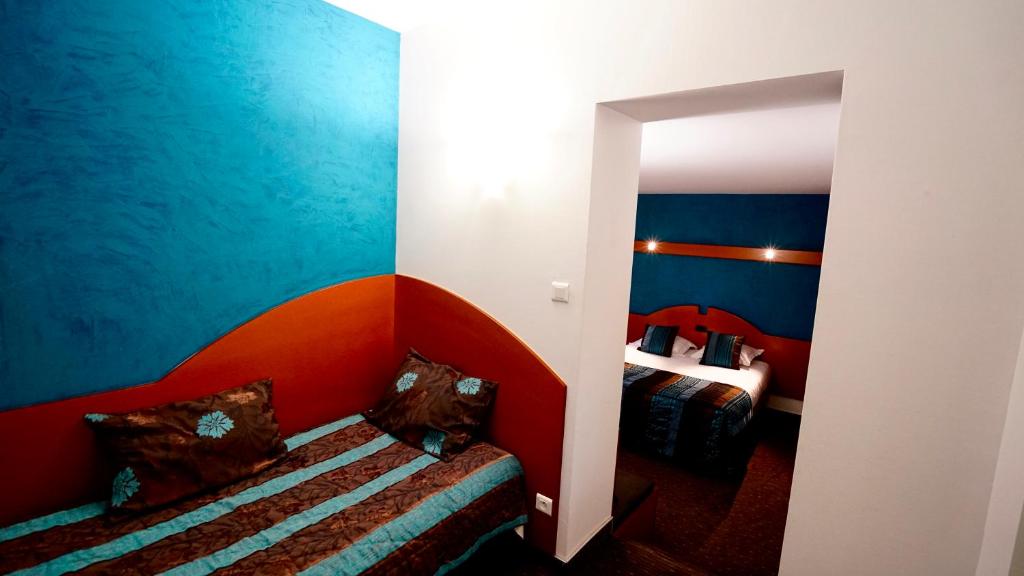 Postel nebo postele na pokoji v ubytování Boutique Logis Hôtel Relais de Vincey