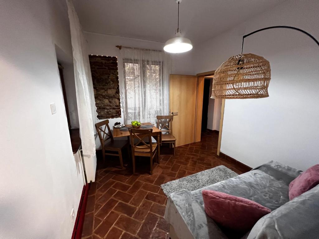 a living room with a couch and a table at Eden Garden in Braşov