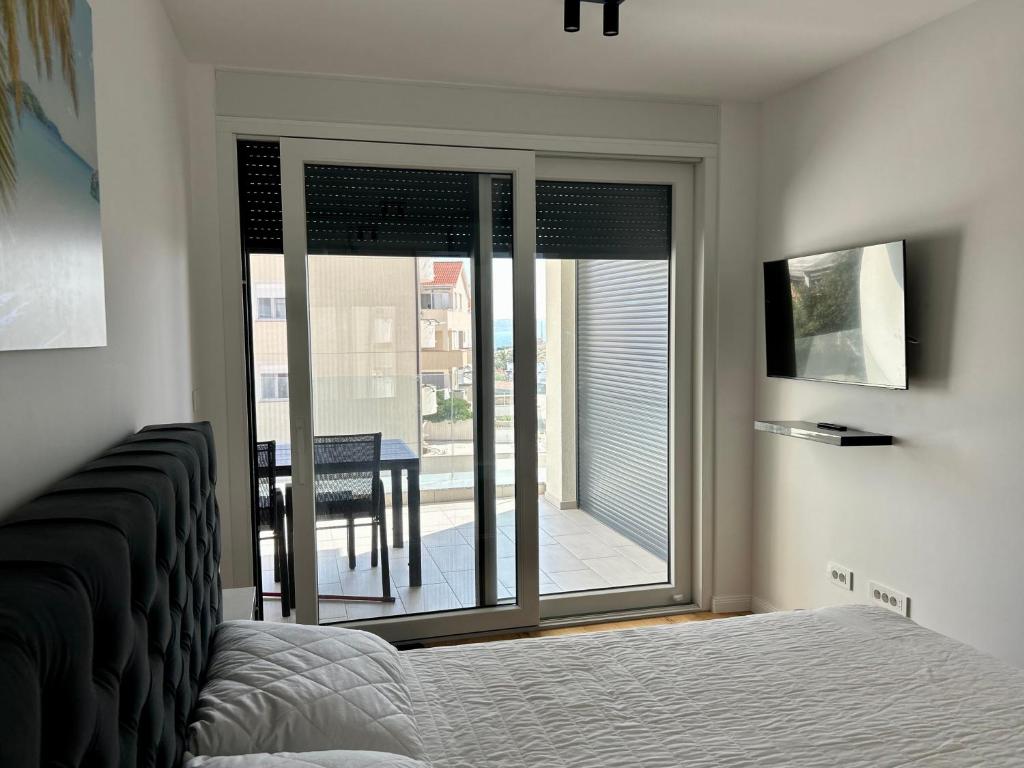 Postel nebo postele na pokoji v ubytování Palm Beach Apartment, Povljana
