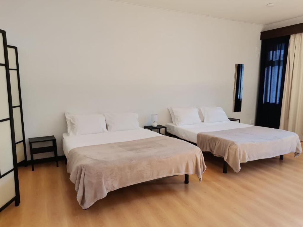 Ένα ή περισσότερα κρεβάτια σε δωμάτιο στο Espaço_Zero [Downtown]