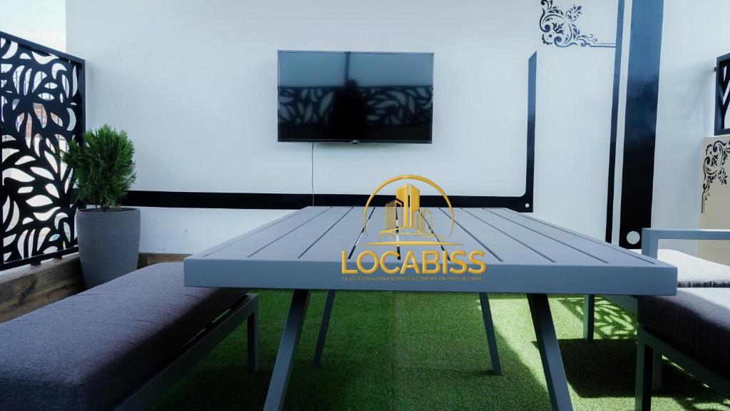 a blue table with a yellow bag on it at LOCABISS 3-Madina in Rufisque
