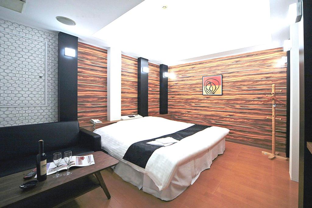 Postel nebo postele na pokoji v ubytování Hotel LALA minato - Adult Only