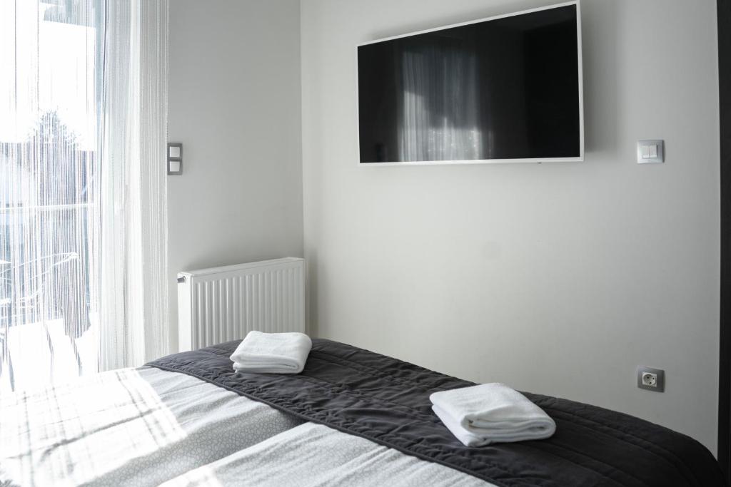 Posteľ alebo postele v izbe v ubytovaní Harmony Apartments Sárvár