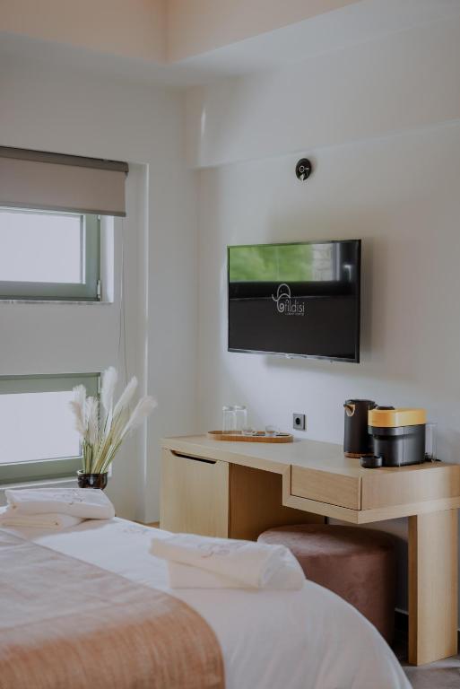 Postel nebo postele na pokoji v ubytování Fildisi luxury suites
