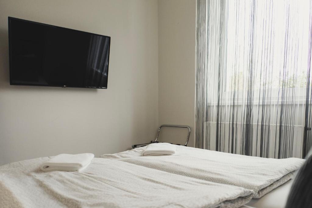 Posteľ alebo postele v izbe v ubytovaní Harmony Apartments Sárvár