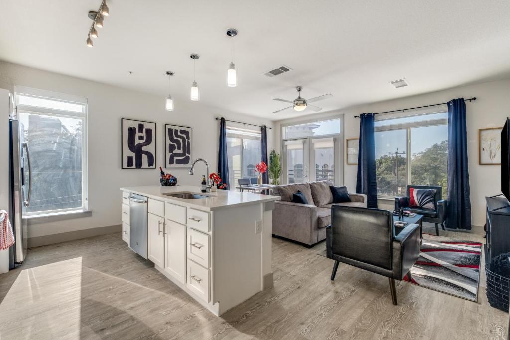 an open kitchen and living room of a home at Radiant condo on the Riverwalk 1325 in San Antonio