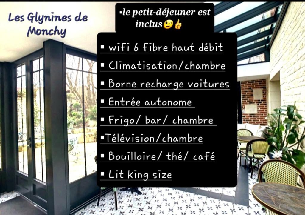 ein Schild für ein Restaurant mit Worten darauf in der Unterkunft Les Glycines de Monchy- Chambres d'hôtes in Monchy-Humières