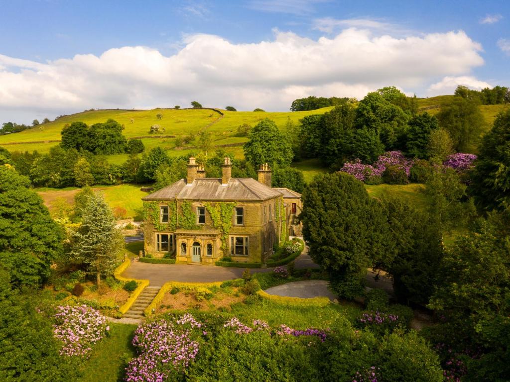 an aerial view of a house in a field at Moorlands Manor in Colne