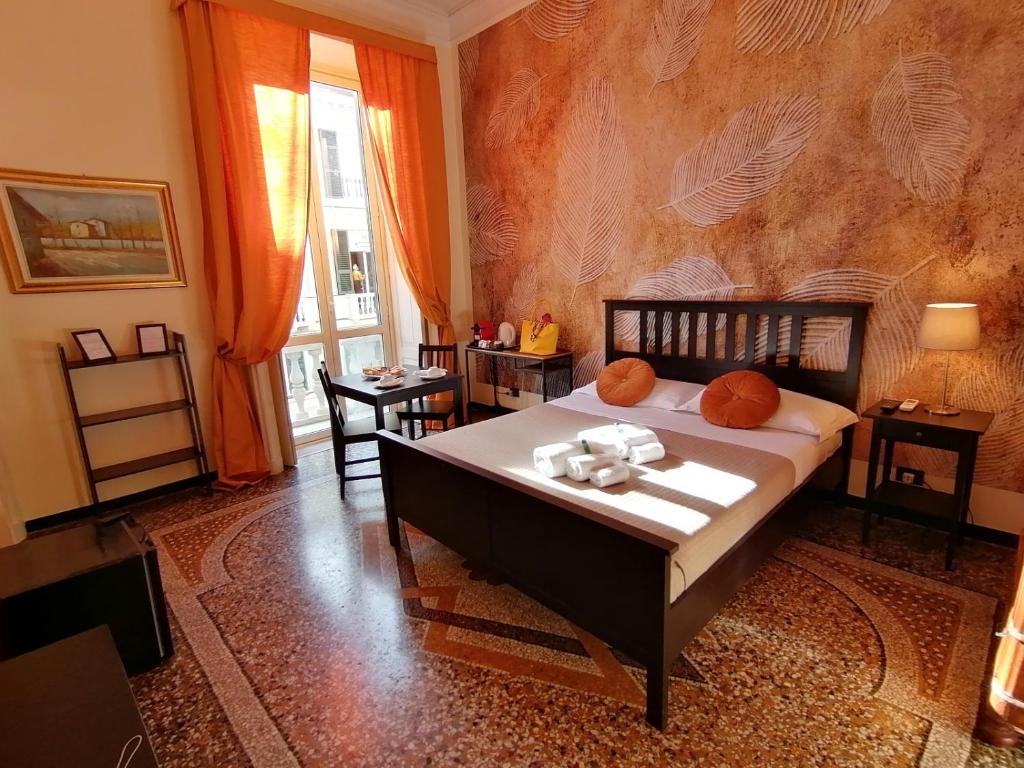 Posteľ alebo postele v izbe v ubytovaní B&B Genova Centro
