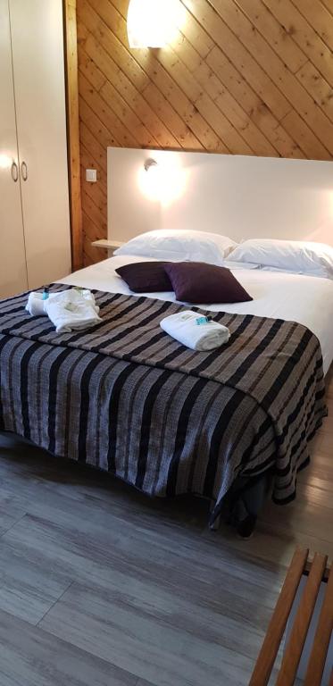 Postel nebo postele na pokoji v ubytování Logis hôtel restaurant les Carillons
