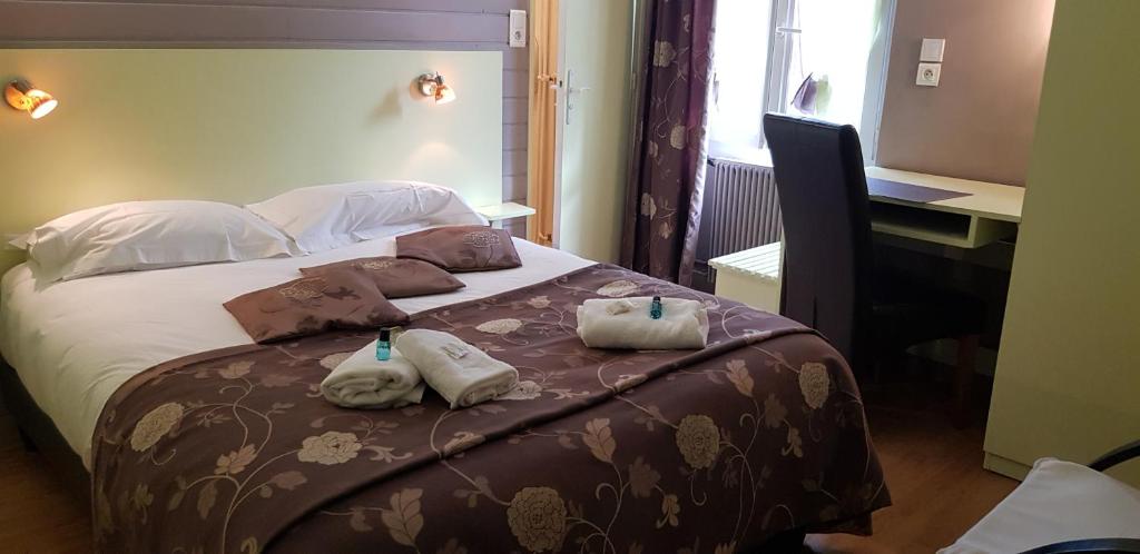Postel nebo postele na pokoji v ubytování Logis hôtel restaurant les Carillons