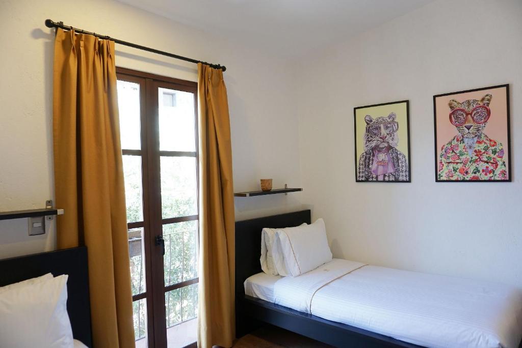 Postel nebo postele na pokoji v ubytování Hotel Pietro Santo