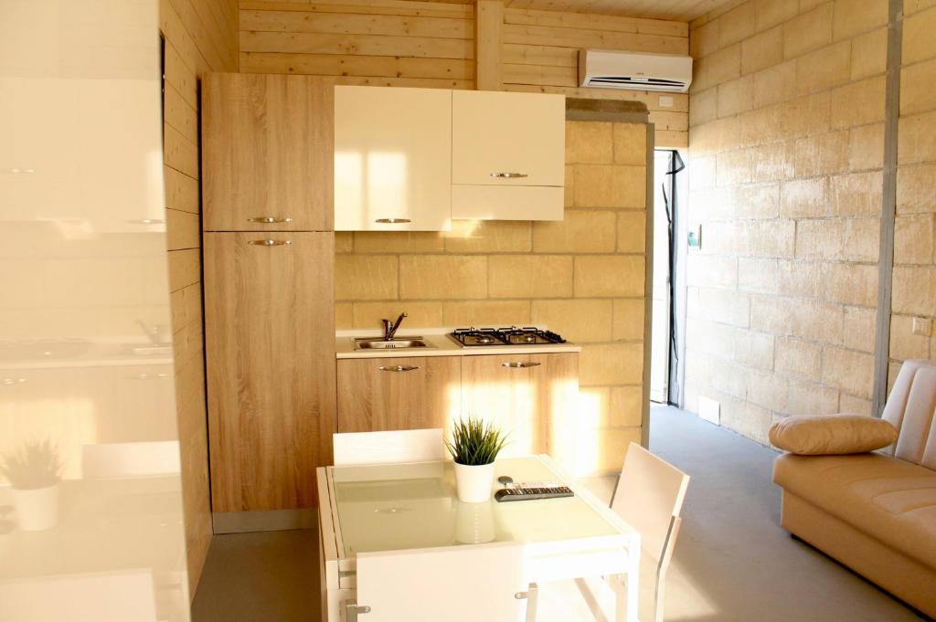 Virtuvė arba virtuvėlė apgyvendinimo įstaigoje Rodovà