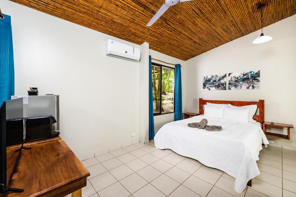 Postel nebo postele na pokoji v ubytování El Sueno Tropical