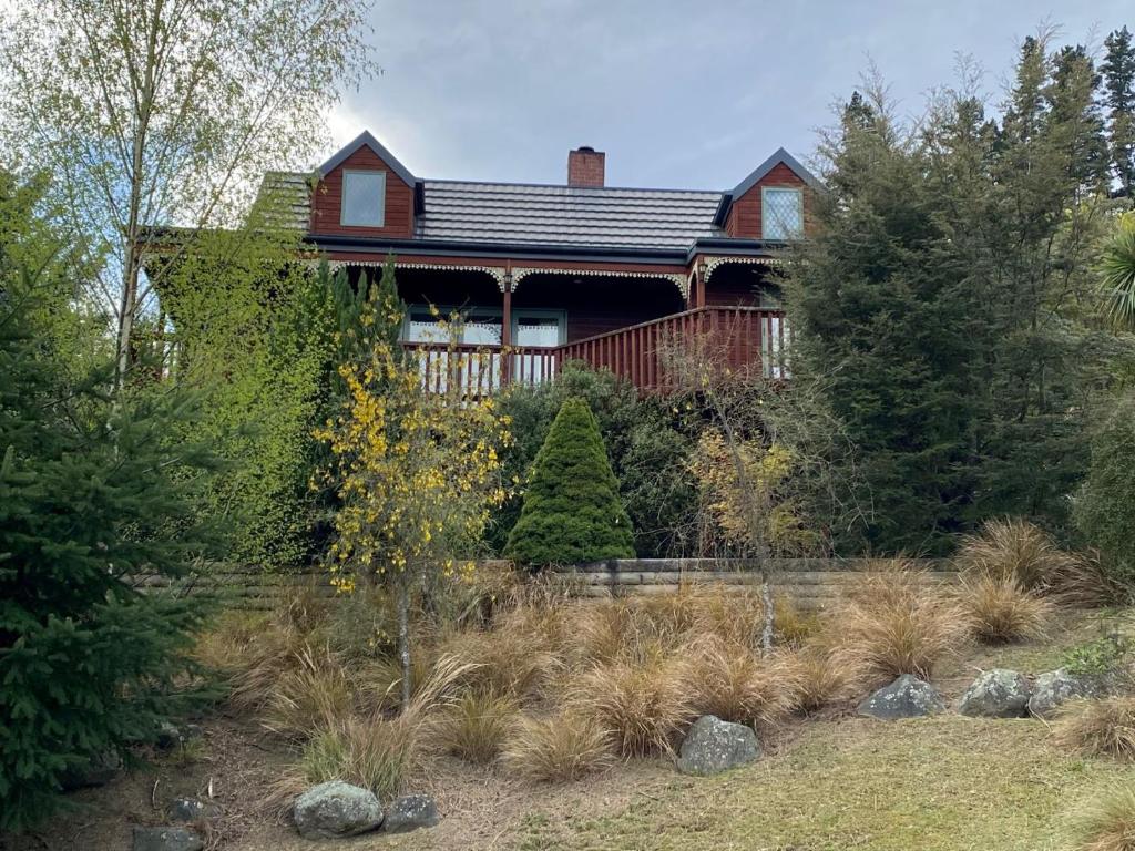 a house with a garden in front of it at 16 Oregon Heights in Hanmer Springs