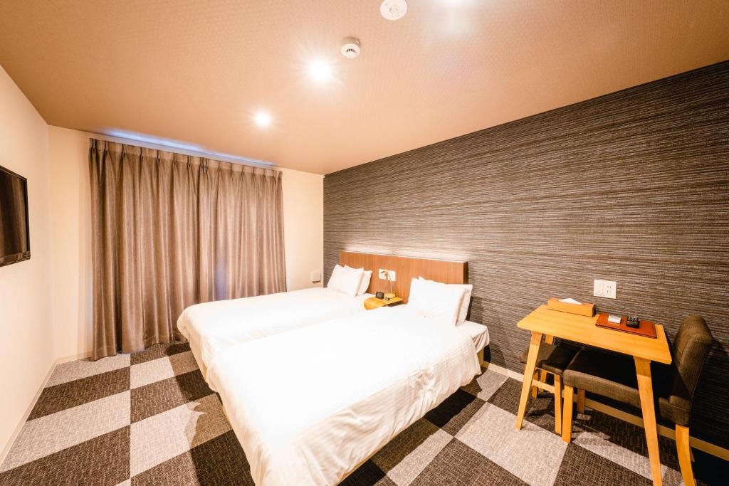 Postel nebo postele na pokoji v ubytování HOTEL THE POINT Kiyomizu Gojo