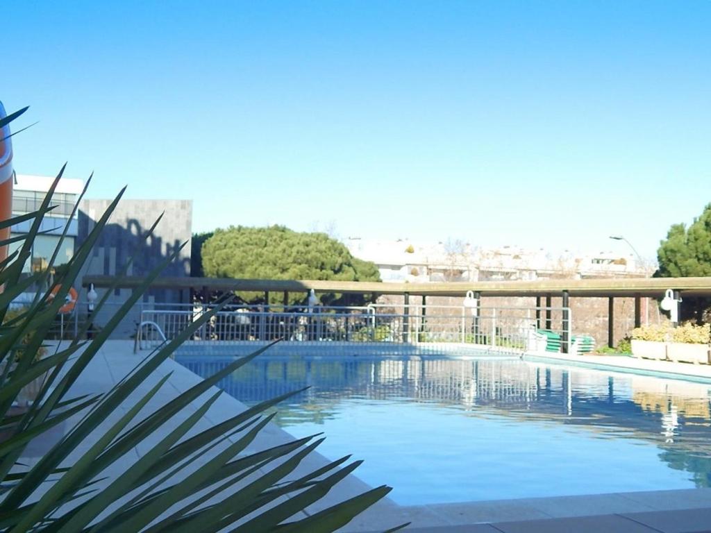 a swimming pool with a view of the city at Apartamento en el Centro de Platja d'Aro con Piscina, Terraza y Cerca de la Playa - ES-209-45 in Platja  d'Aro