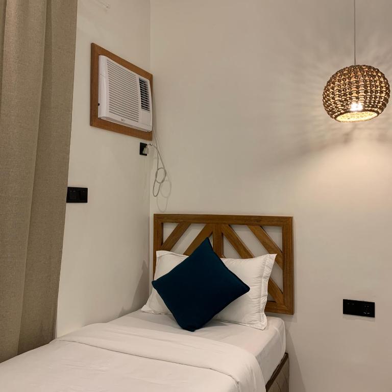 Postel nebo postele na pokoji v ubytování Bahandi Hotel