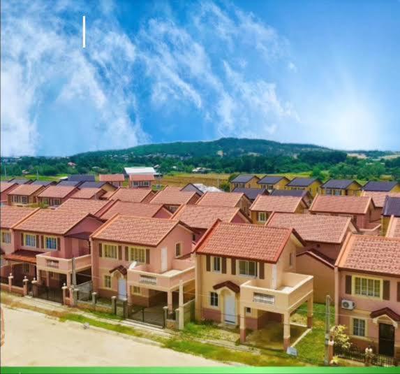 a row of houses with red roofs at Camella homes laoag city ilocos norte in Bangued