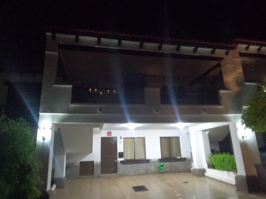 a house with lights in front of it at night at MADDY Free Wi-Fi, AC in ea Bedrooms, Private Community! in San Miguel