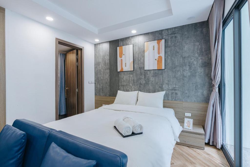 Postel nebo postele na pokoji v ubytování Westlake Emerald Suites