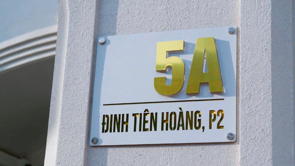 a sign on a building with the on it at Milan Homestay - Milanesa Hotel and Apartment in Vung Tau